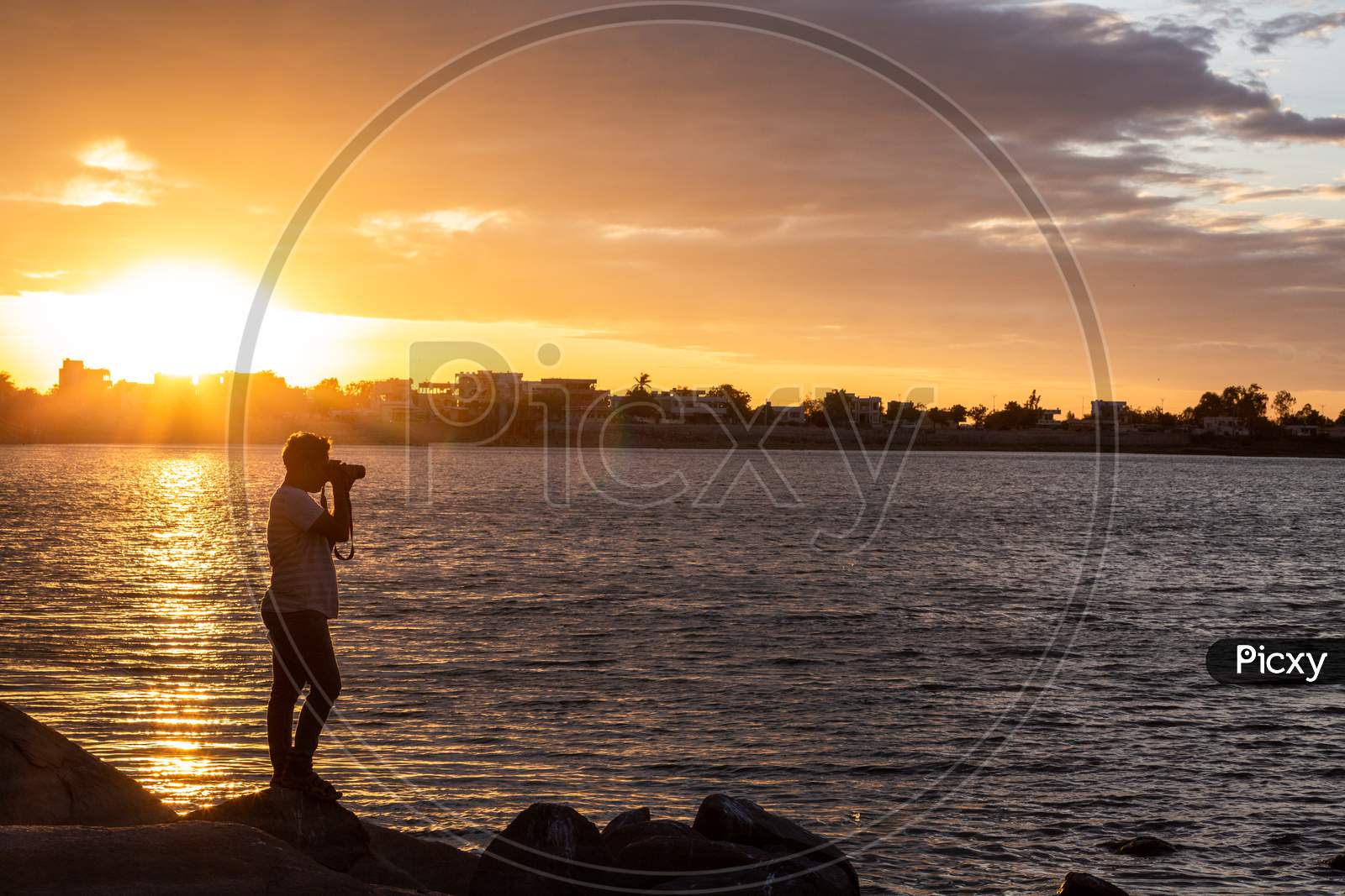 Indian Photographer Man shooting during sunset