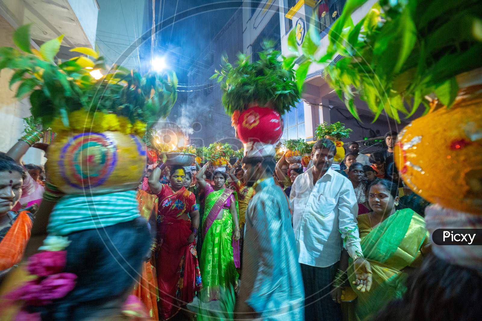 Devotees Carrying Bonam Over Their Heads At Bonalu Festival Celebrations in Hyderabad