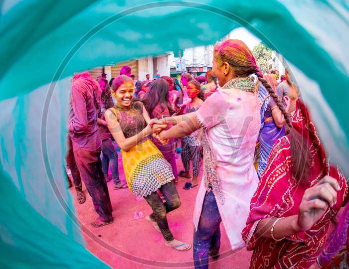 View of Indian girls cheering during Holi Festival
