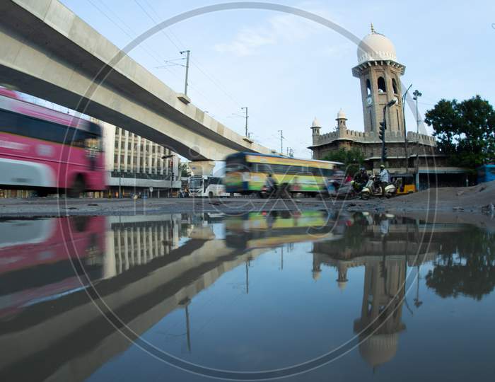 Reflection Of Metro Track And Pillars on an Water Surface At Mojamjahi Market