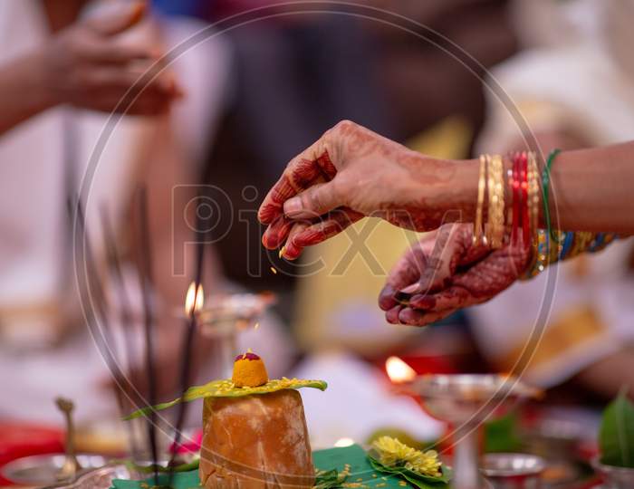 South Indian Wedding Rituals With Bride And groom Hands Performing Pooja At Wedding Ceremony