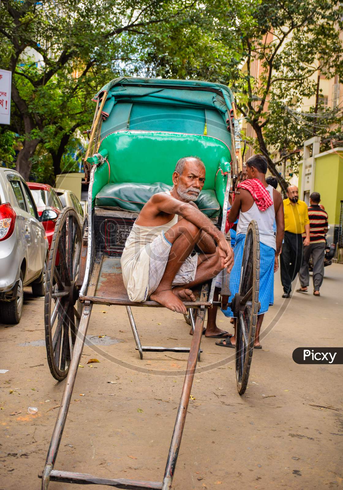 An Elderly Man Rickshaw Puller At Kolkata