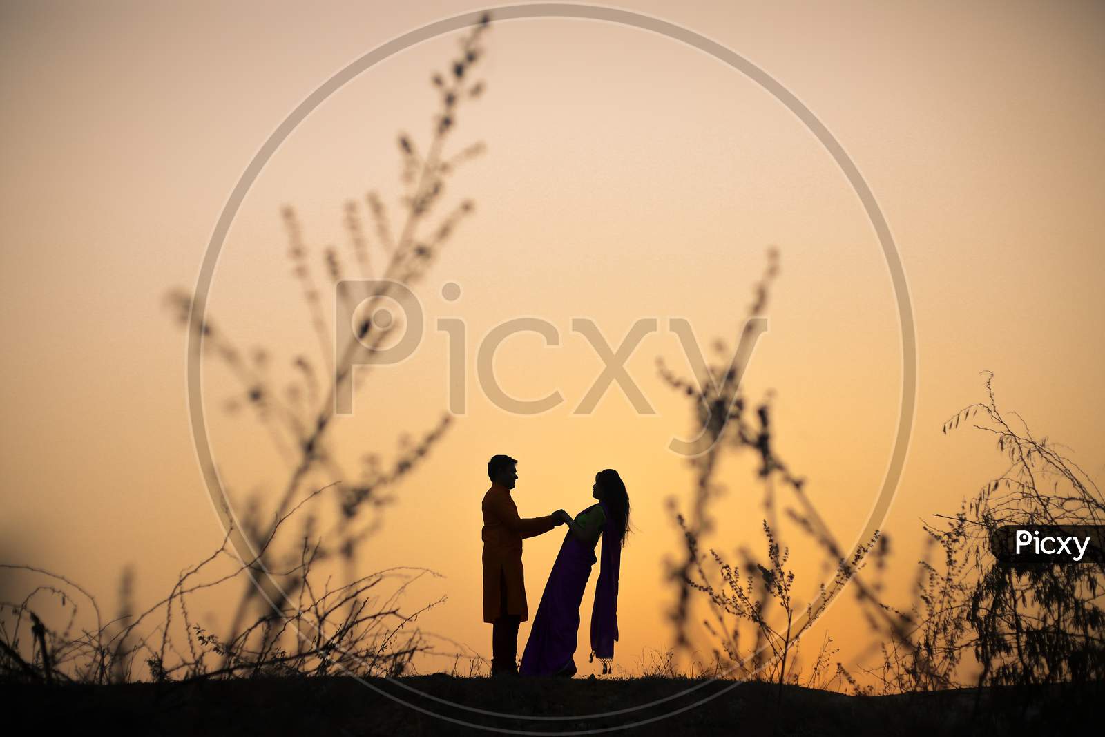 Indian couple during the sunset