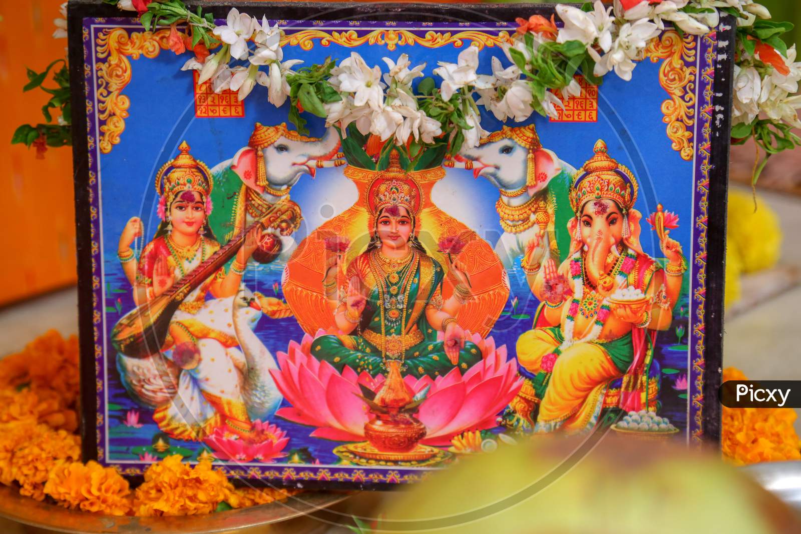 Goddess Lakshmi Photo Frame In Pooja During Hindu Wedding