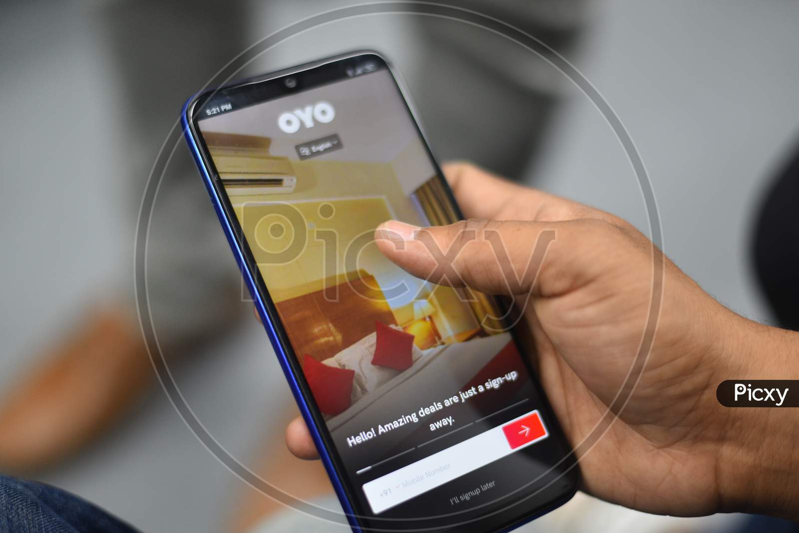 Indian Man using OYO Rooms app