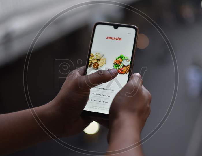 Indian Man ordering food on Zomato Food Delivery app