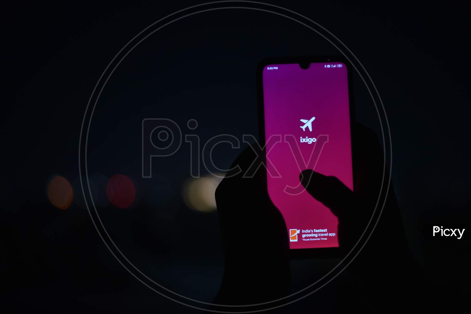 A Mobile display showing ixigo app