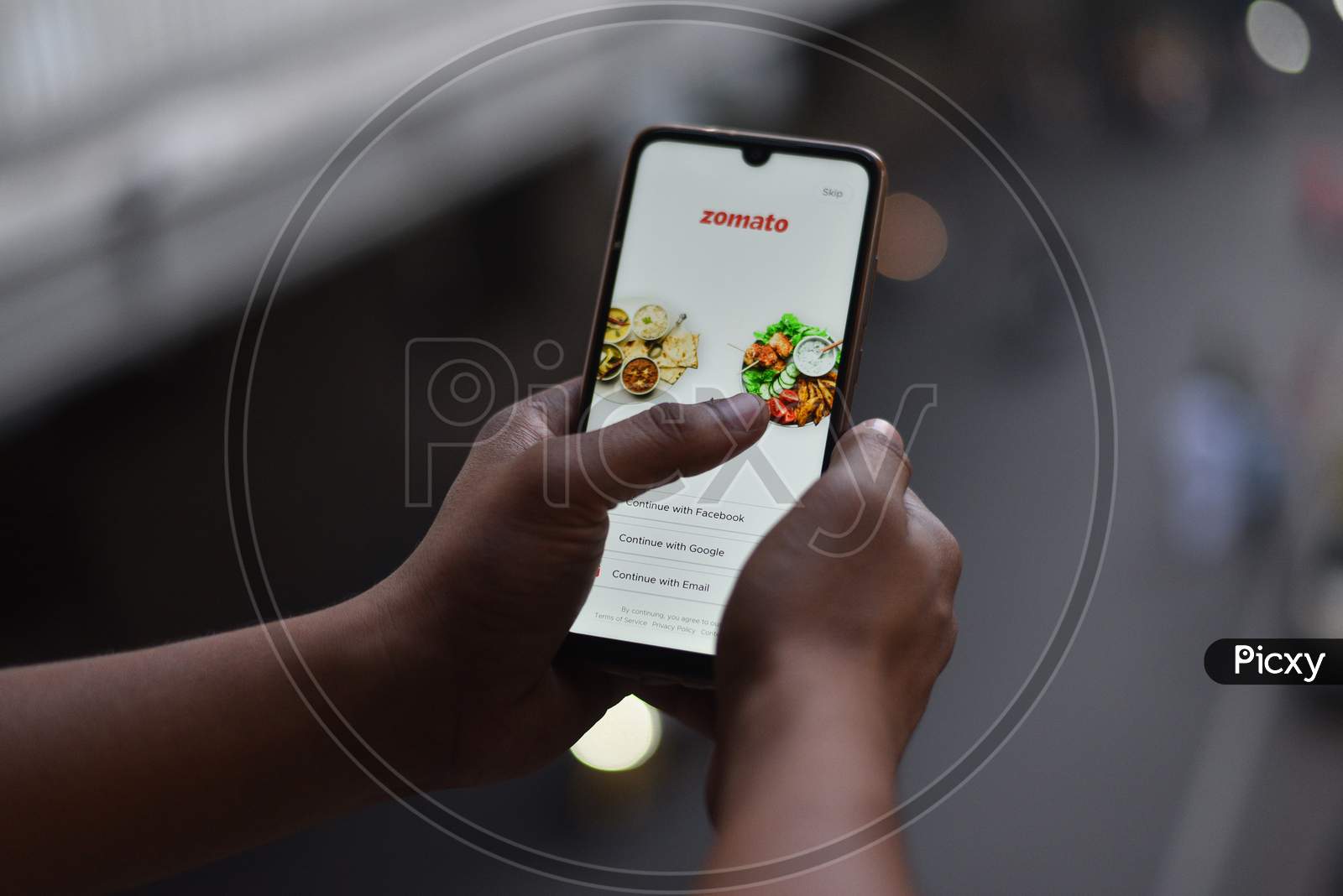 Indian Man ordering food on Zomato Food Delivery app