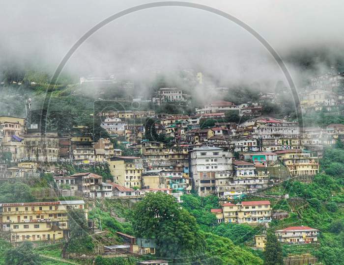 Houses On The Valleys With Fog  Clouds