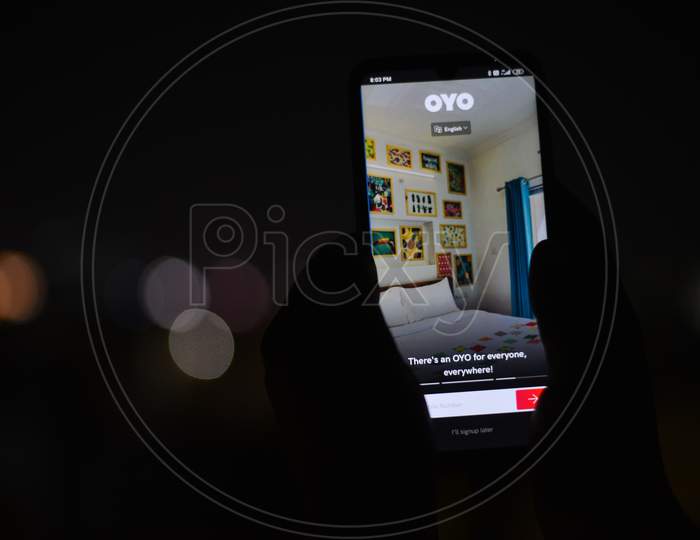Android Phone display showing OYO Rooms app homepage