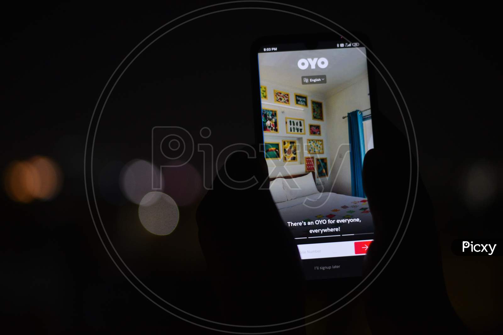 Android Phone display showing OYO Rooms app homepage