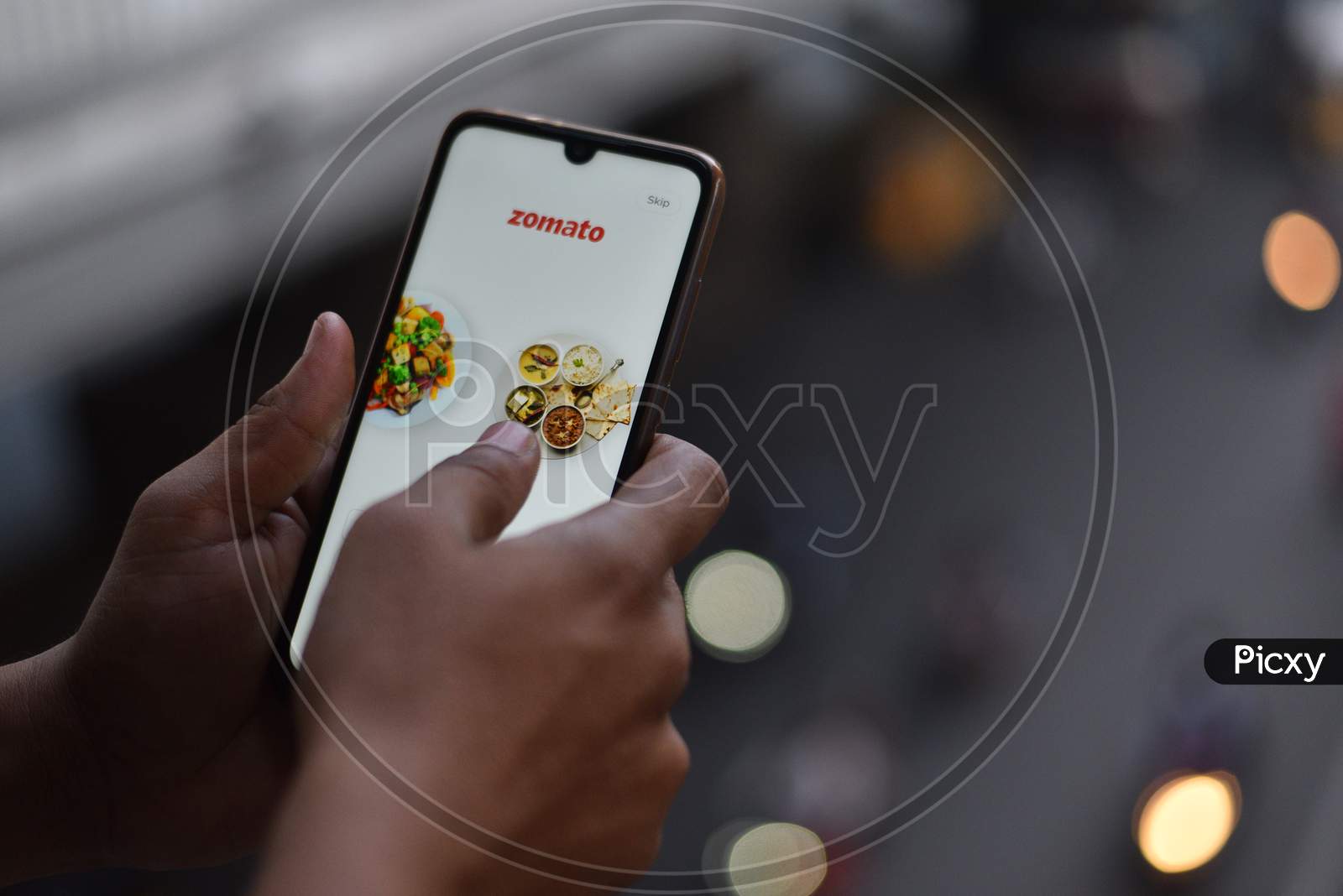 Indian Man ordering food on Zomato App