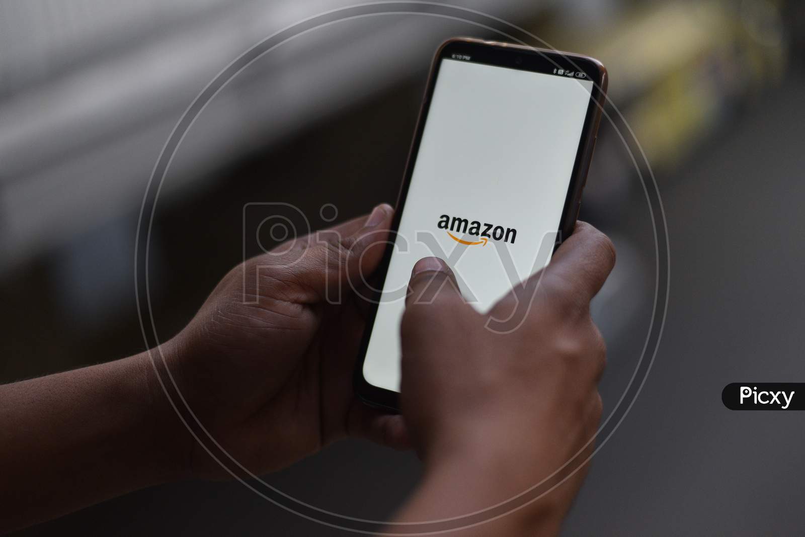 Indian Man logging in on Amazon Shopping App