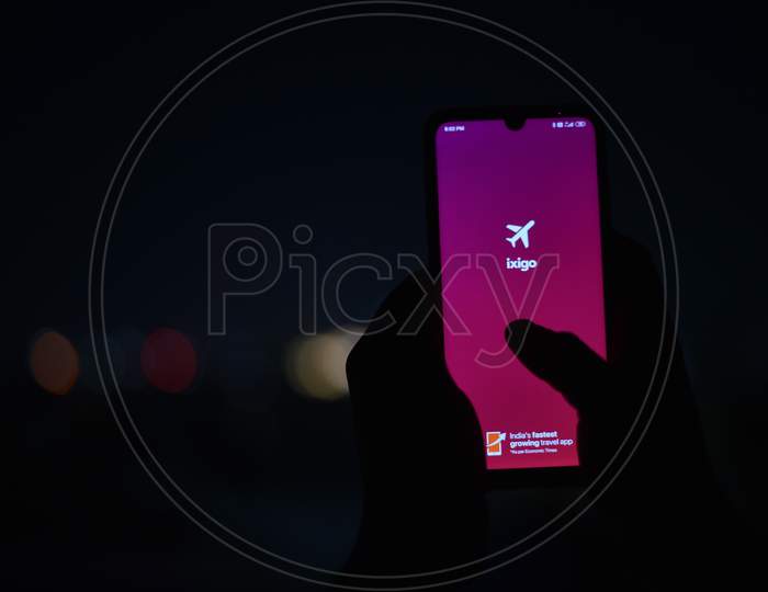 A Mobile display showing ixigo app