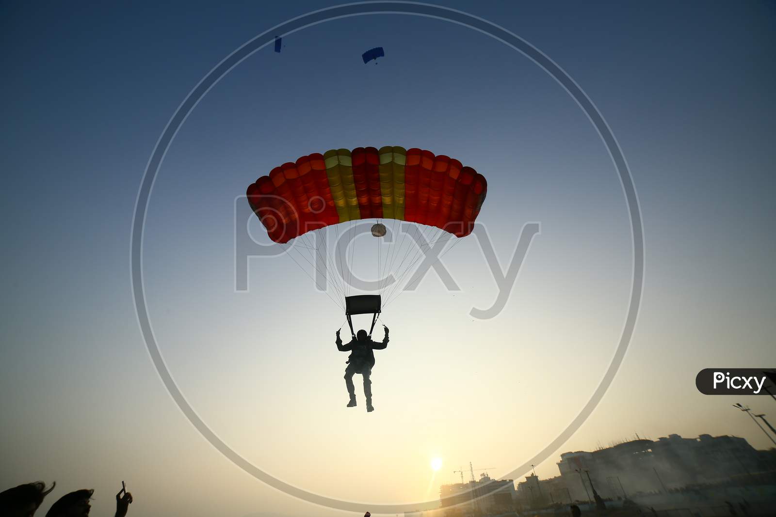Indian Man paragliding by the beach