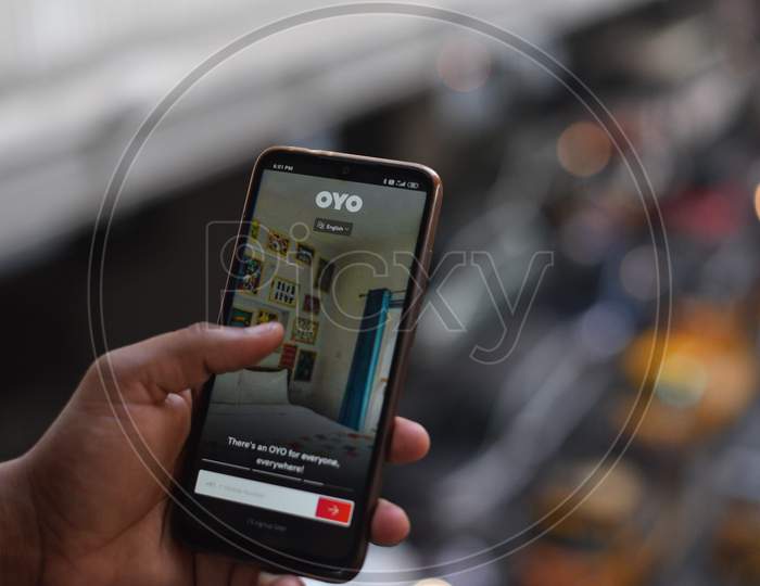 Indian Man registering on OYO Rooms app