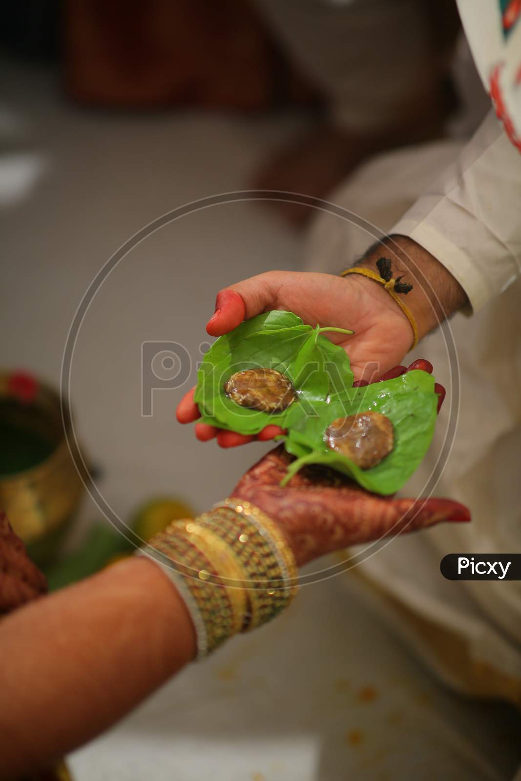 Indian bride and bride groom with Jaggery and Cumin