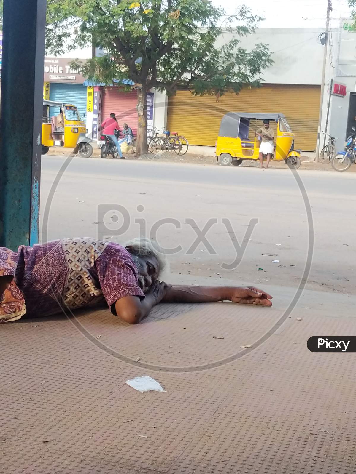 An Indian homeless man sleeping on the floor