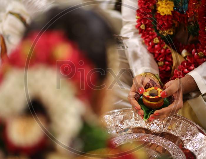 Indian Bride Groom holding the sacred sindhoor