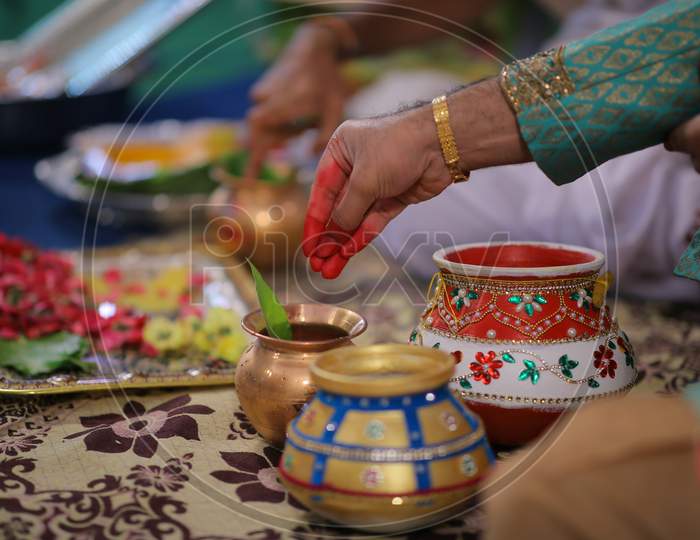 Indian bride groom hands during puja