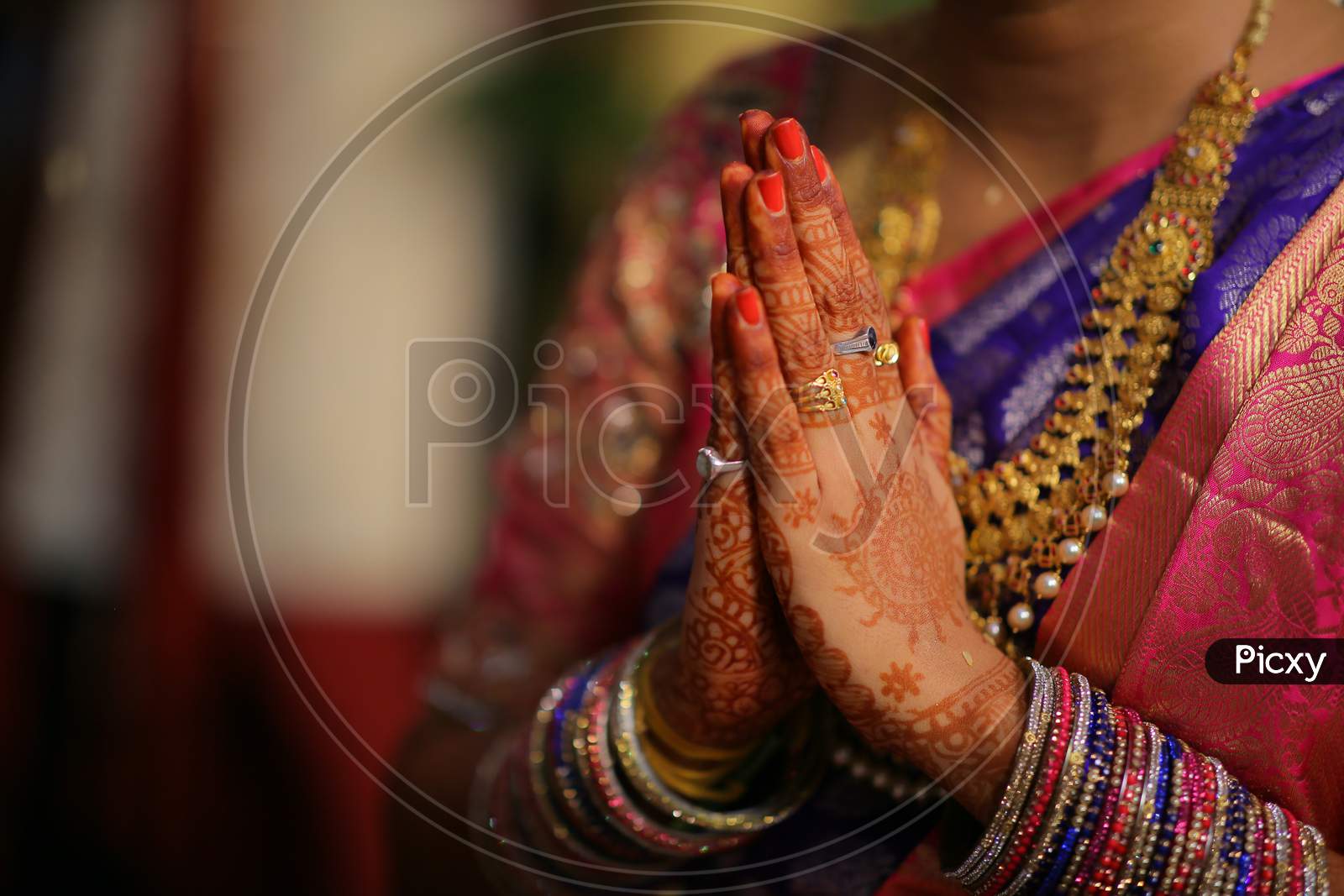 Indian bride hands during puja