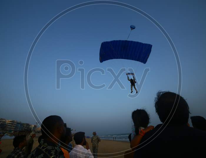 View of people spectating the paragliding