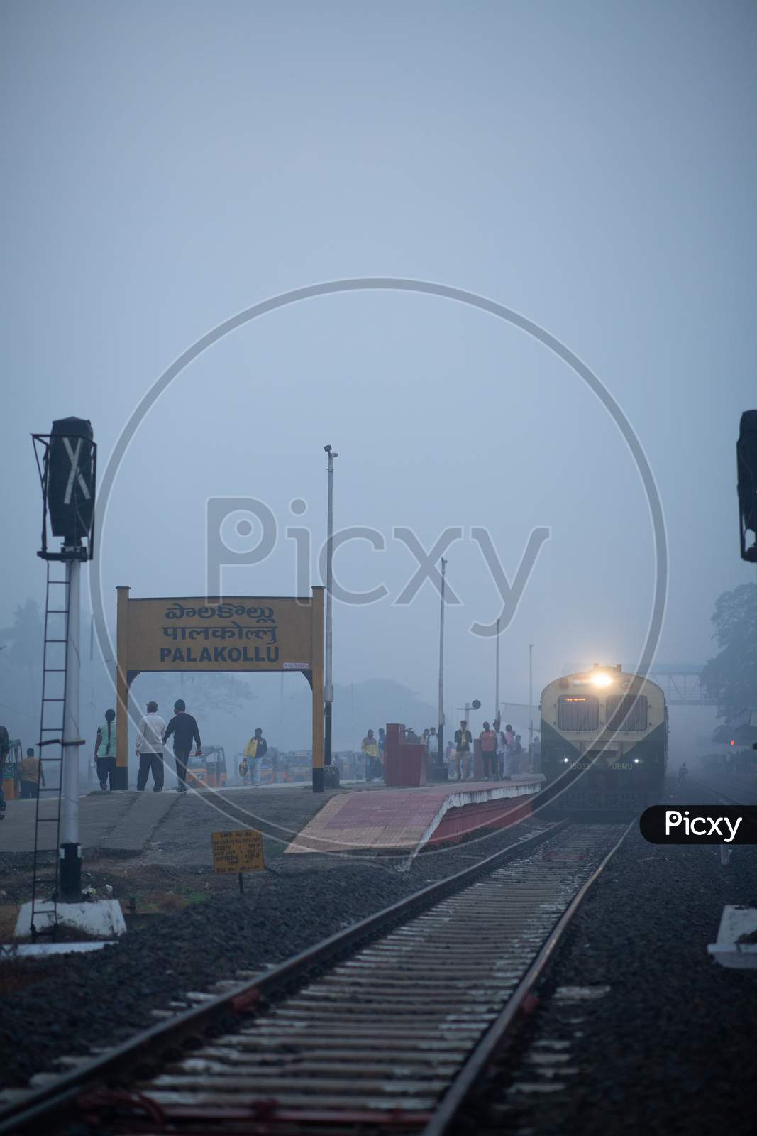 Palakollu Railways Station Platform With Indian Railway Train On Track On an Foggy Morning