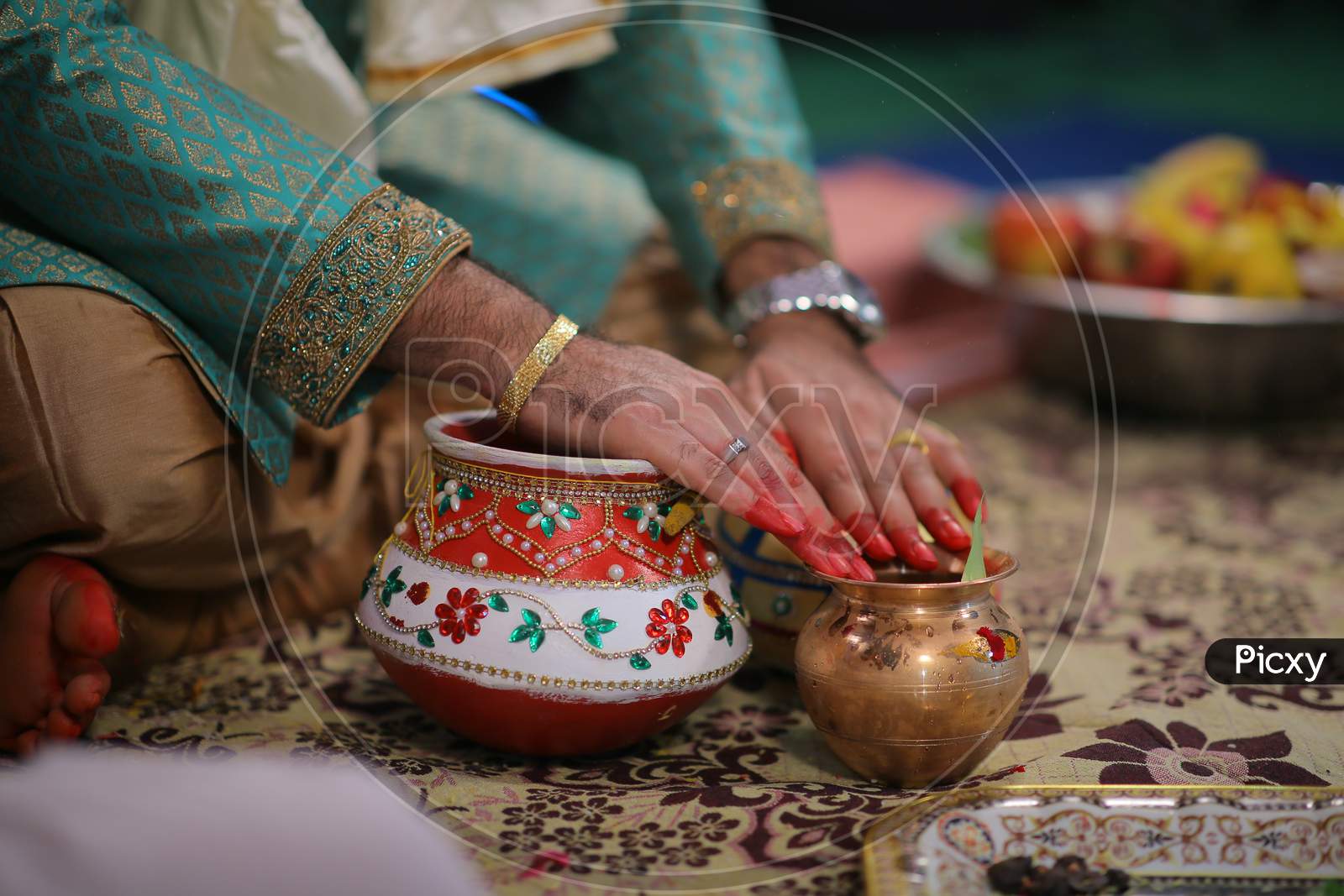 Indian bride groom hands during wedding puja