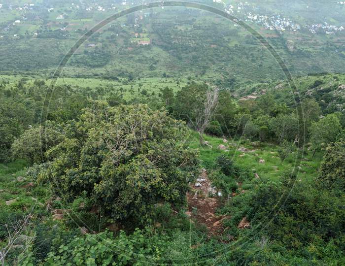 Aerial view of boulder hill with vegetation