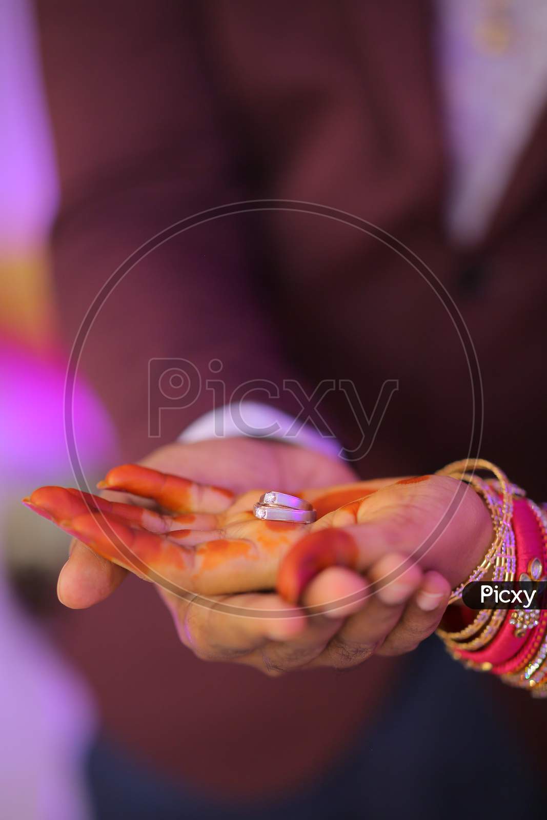Engagement ring in the palm of Indian bride
