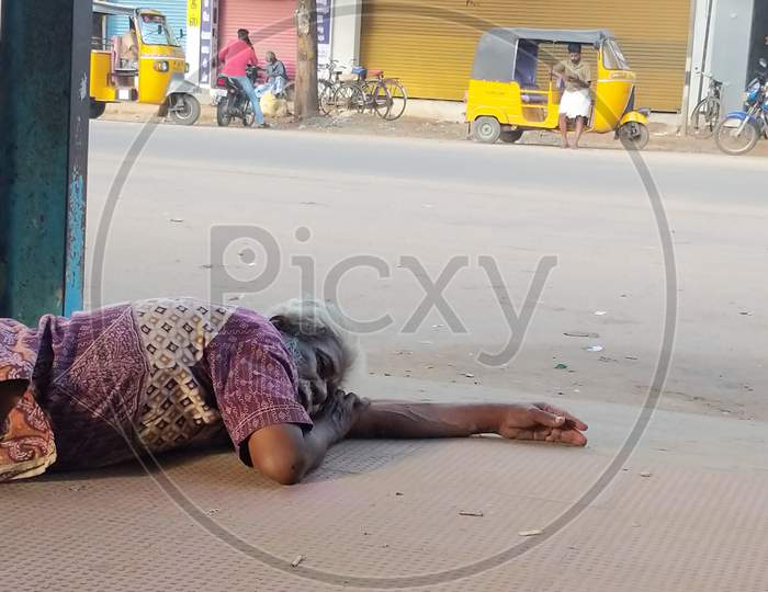An Indian homeless man sleeping on the floor