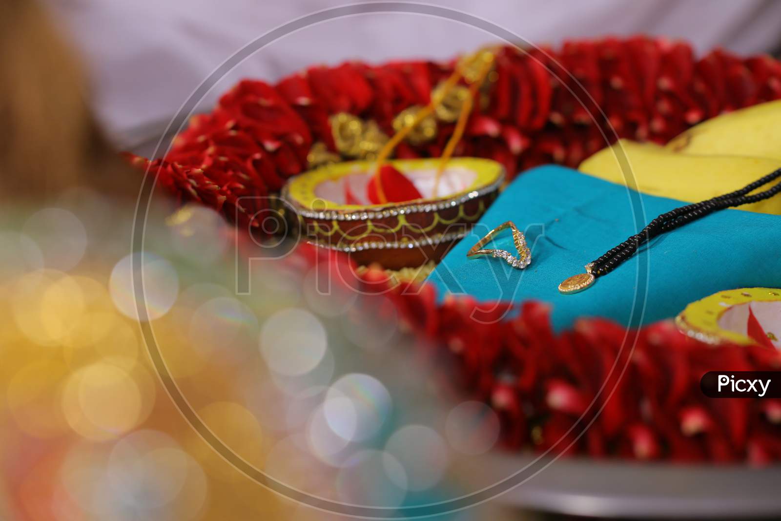 Engagement ring and other necklace during wedding puja