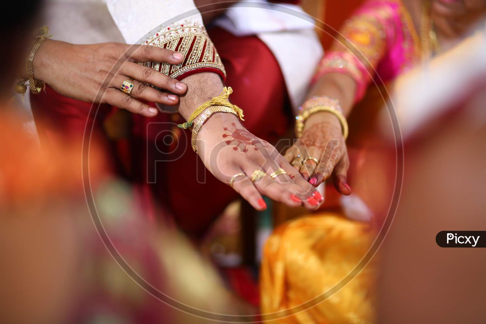 Indian bride and groom during puja