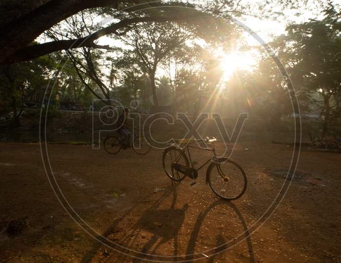 Shadow Of Bicycle Over a Bright Sun