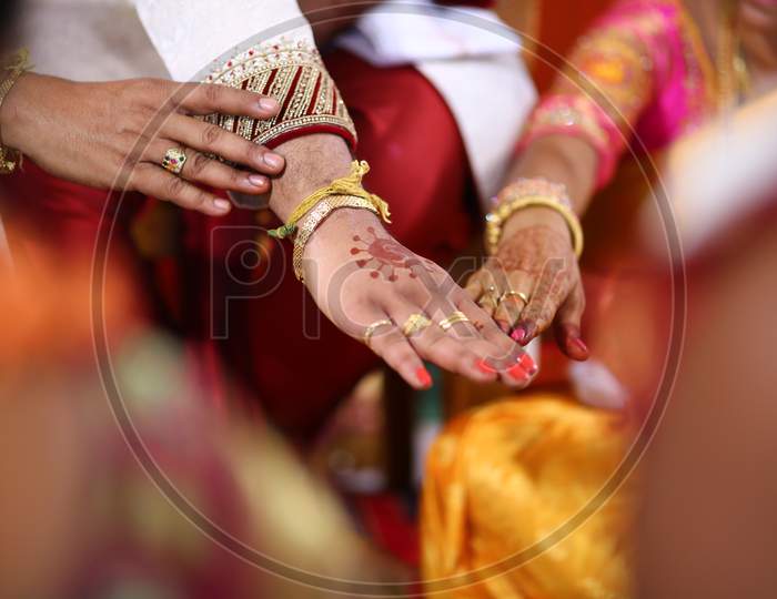 Indian bride and groom during puja