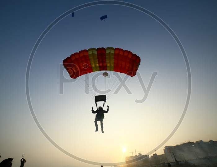 View of Indian man paragliding in the sky