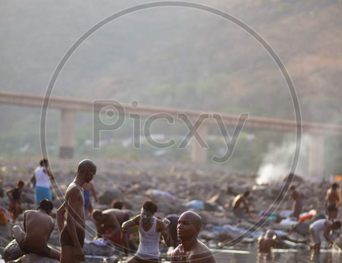 Indian Make devotees bathing in the river