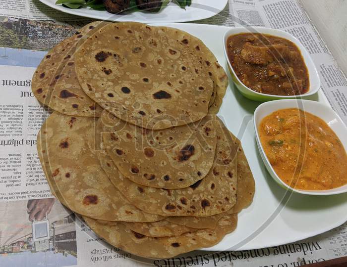 Indian Chapathi with two curries served in a plate