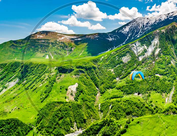 Paragliding Over The Caucasus Mountains At Gudauri, Georgia