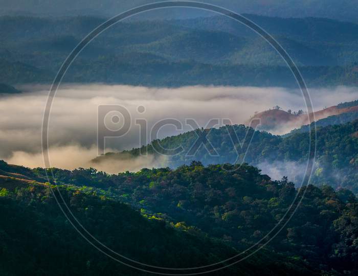 Clouds flowing like a river in the valley of Western Ghats of Mandalpatti, Madikeri