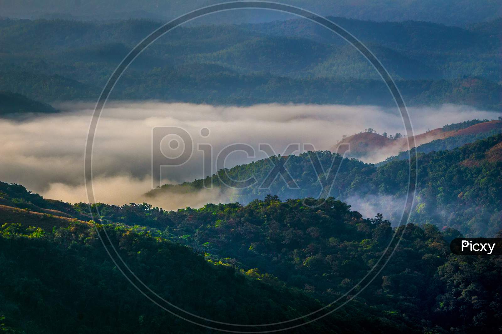 Clouds flowing like a river in the valley of Western Ghats of Mandalpatti, Madikeri