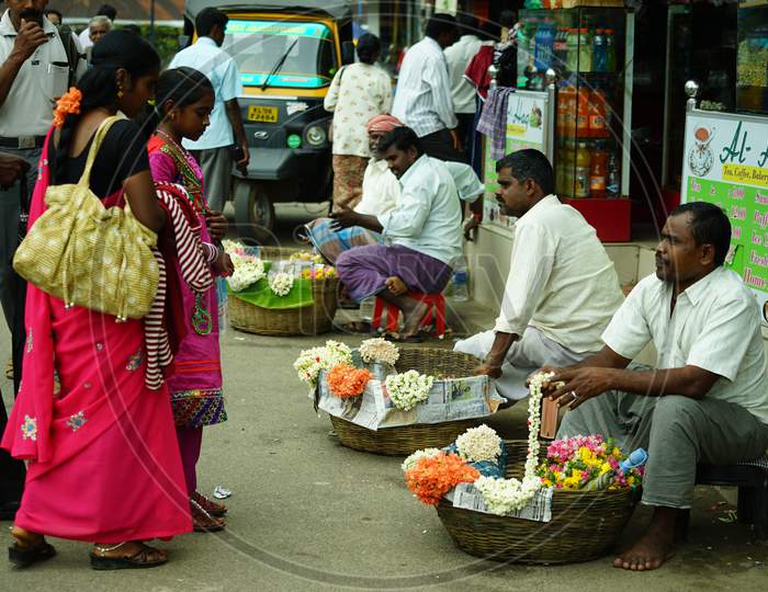Indian local men selling flowers