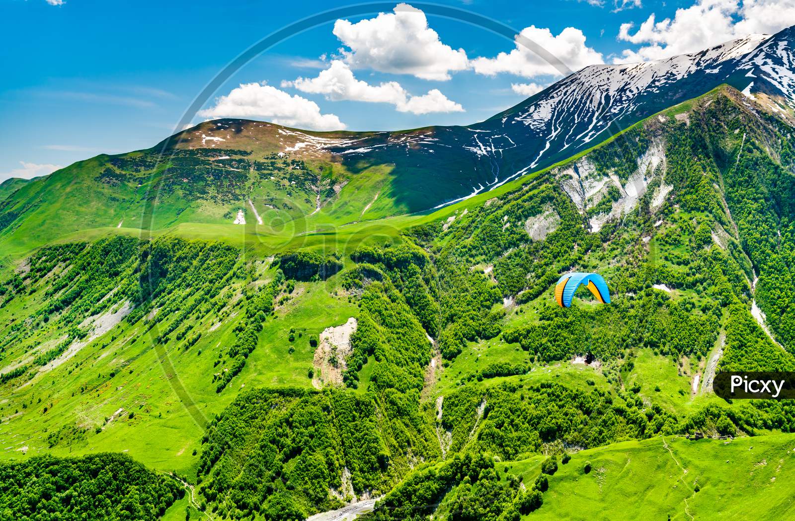 Paragliding Over The Caucasus Mountains At Gudauri, Georgia