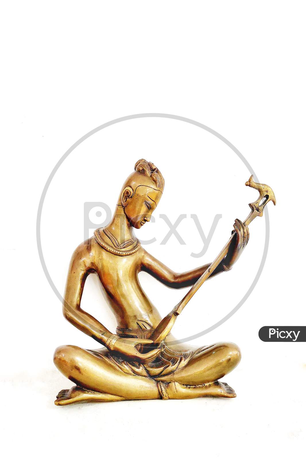 Brass Idols Of Indian Traditional Musicians  Over a White Background