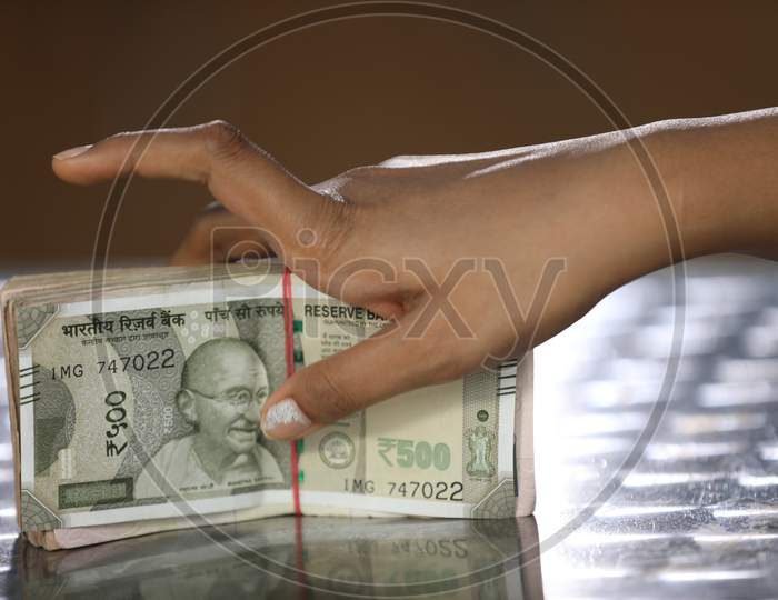 An Woman Hand On Indian Currency Bundle