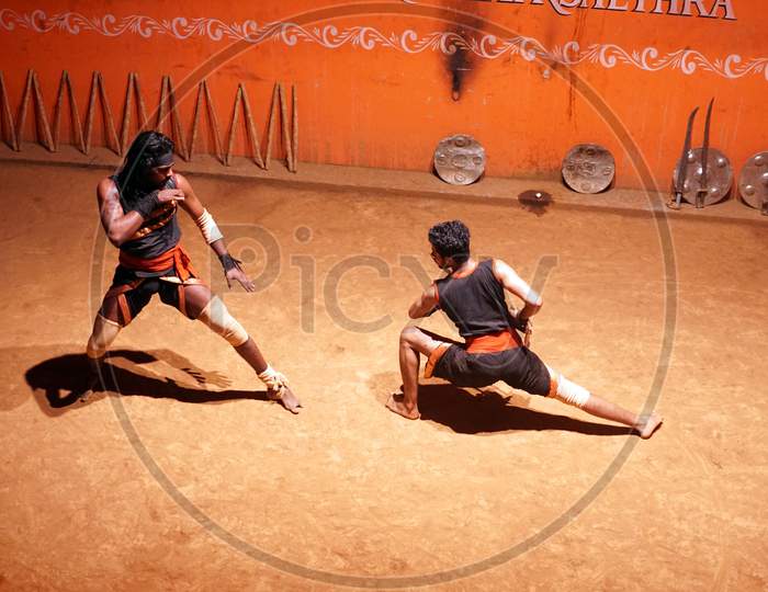 Indian men during sword fight in the arena