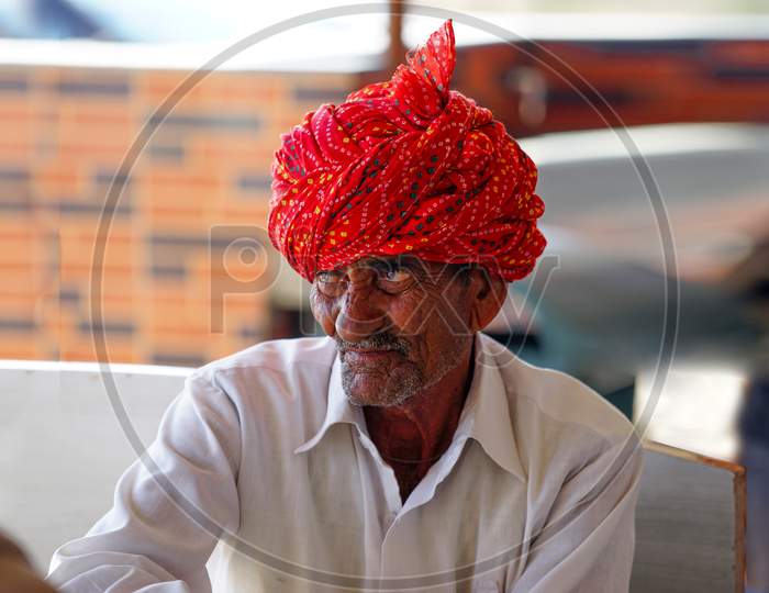 Portrait of Rajasthani man wearing red turban