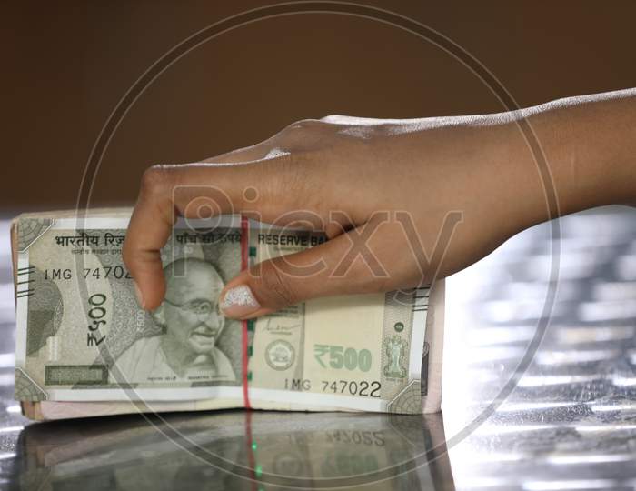 An Woman Hand On Indian Currency Bundle