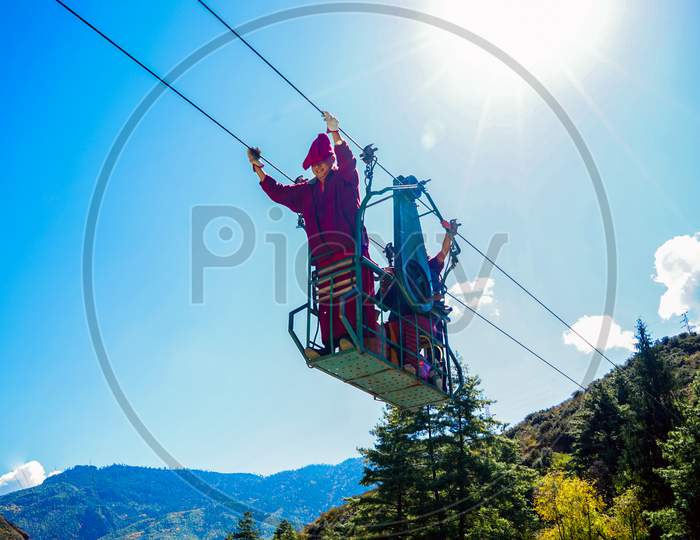 View of Nepalese men using Cable Car