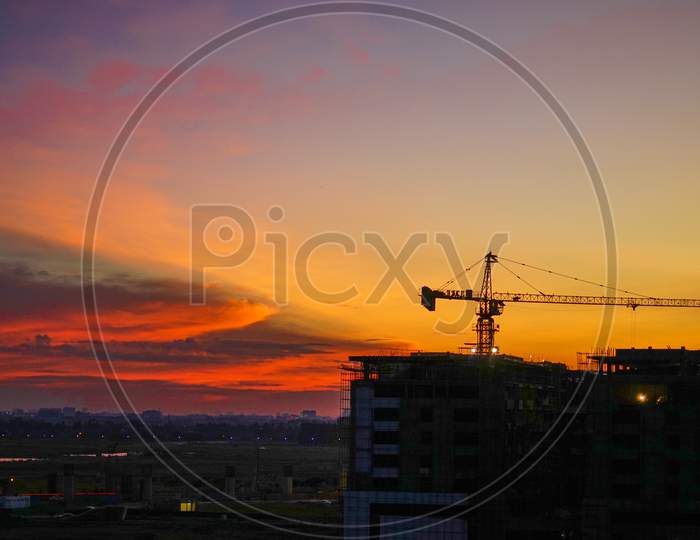 Silhouette of Tower Crane during sunset